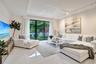 large living space with lush green views