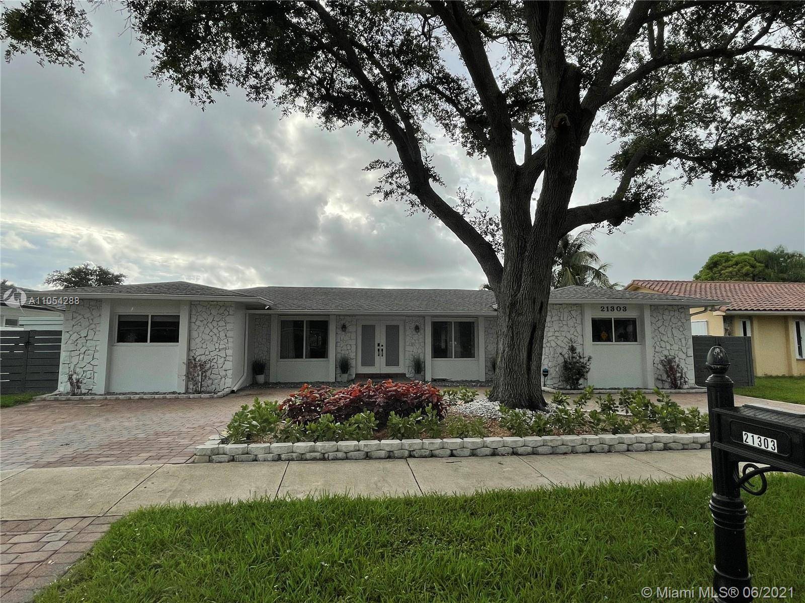 TOTALLY RENOVATED MODERN HOME in Highland Lakes gated neighborhood.