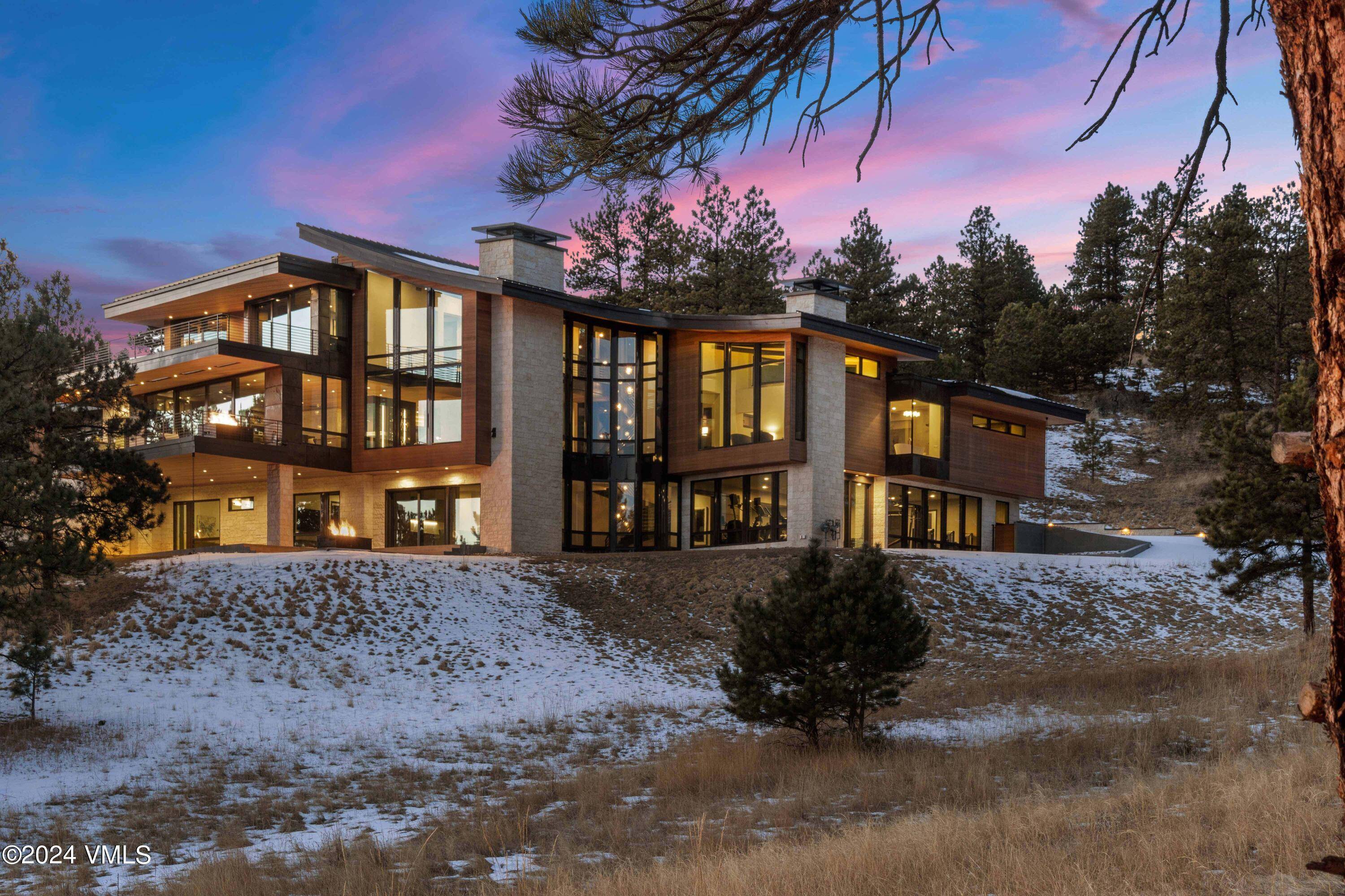 Tucked away in the quiet grandeur of Evergreen, Colorado, this luxurious 9, 459 square foot home sits on a private 10.