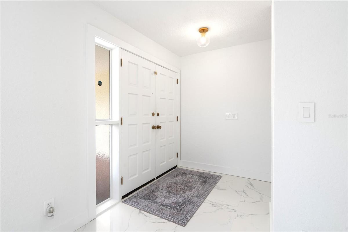 Walk in front door. Notice the beautiful new white tiles.