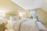 Bedroom featuring lofted ceiling