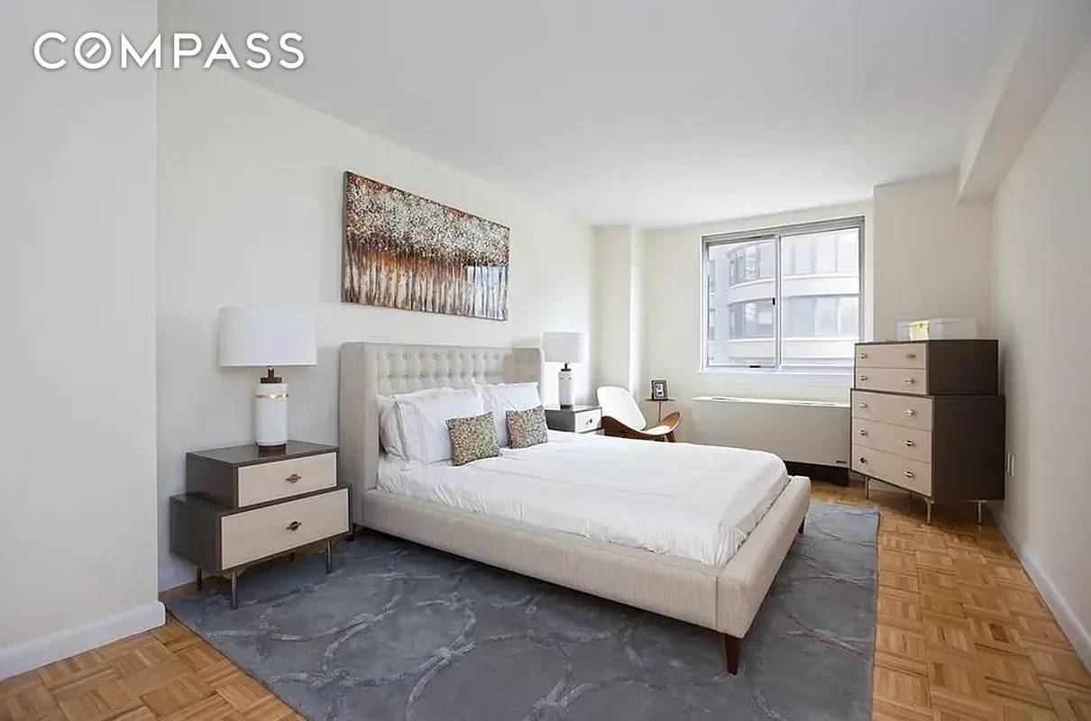 Spacious Sun bathed Two Bedroom Convertible Three bed condominium with washer dryer.