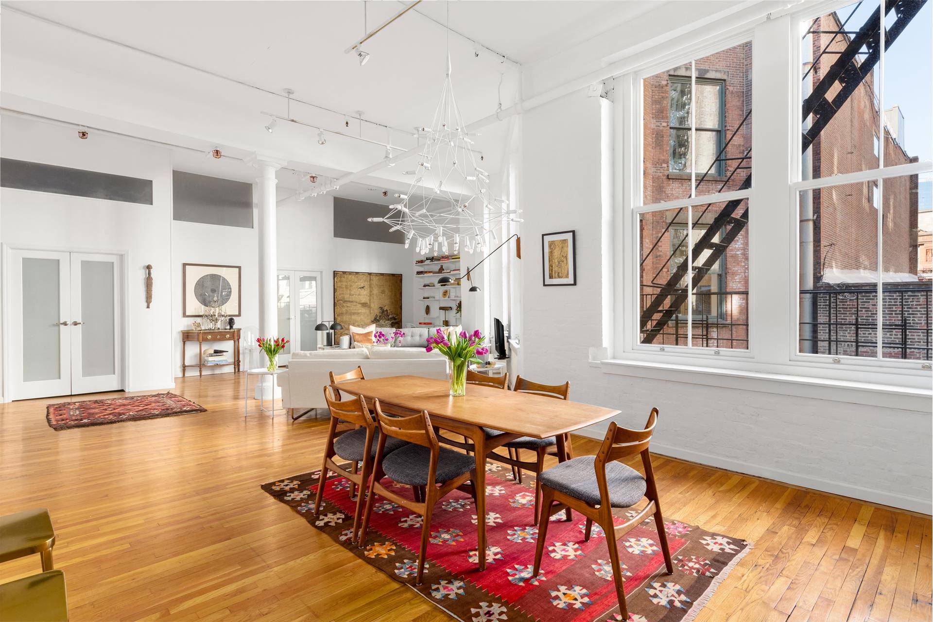 Instantly feel the warmth and spaciousness of this classic Soho loft the moment you walk into the combined living and dining area, where over sized, updated double paned windows wash ...