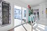 Doorway to outside with wood finished floors and baseboards