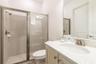 Modern full bathroom with walk in shower and upgraded finishes in Margaritaville Resort Orlando