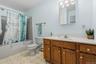 Easy step in tub and oversized vanity for all your necessities.