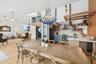 Dining area featuring light wood-type flooring, beverage cooler, OPEN LIVING