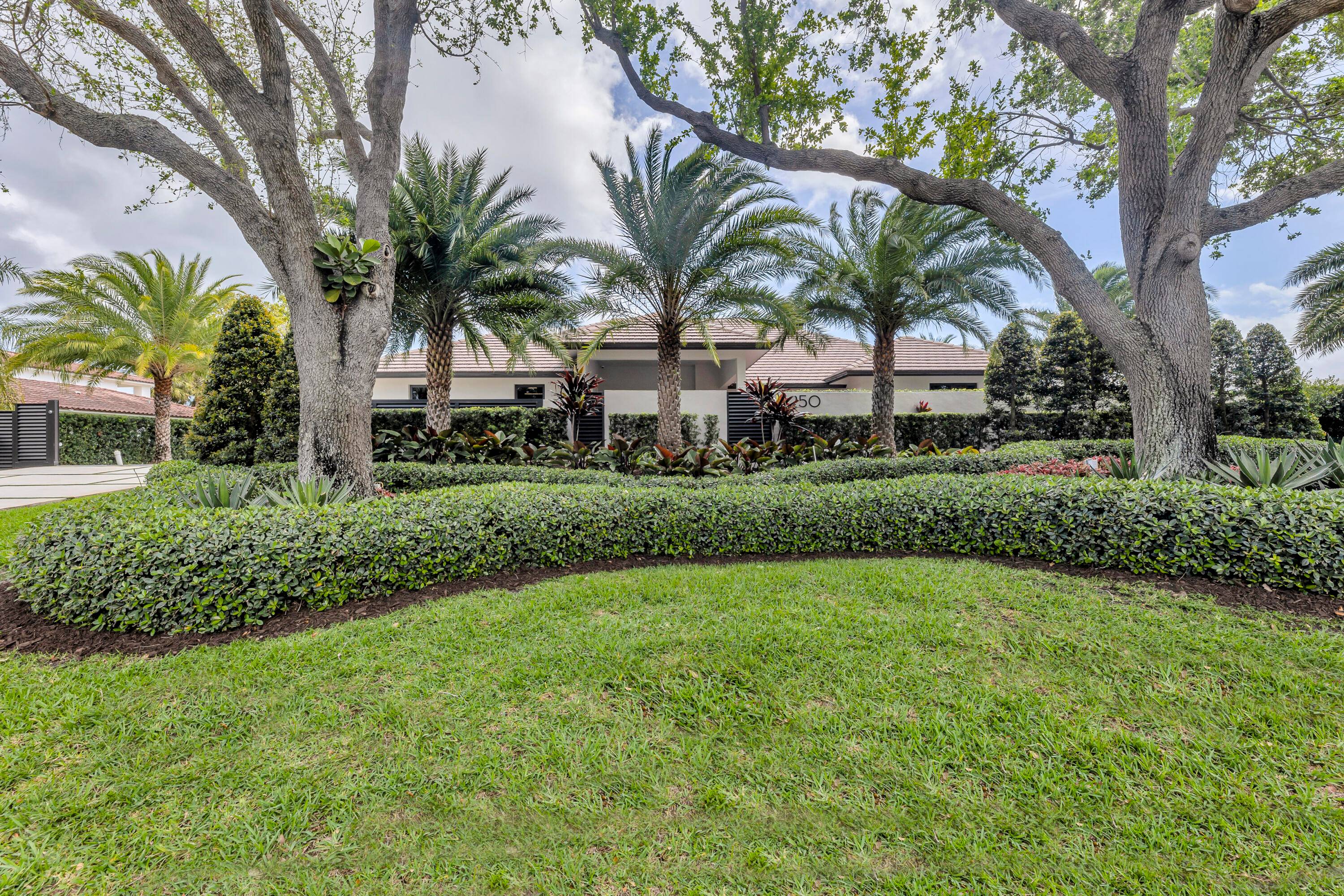 Introducing this exquisite family home on enormous 1 2 acre directly on the prestigious Coral Ridge Country Club Golf Course.