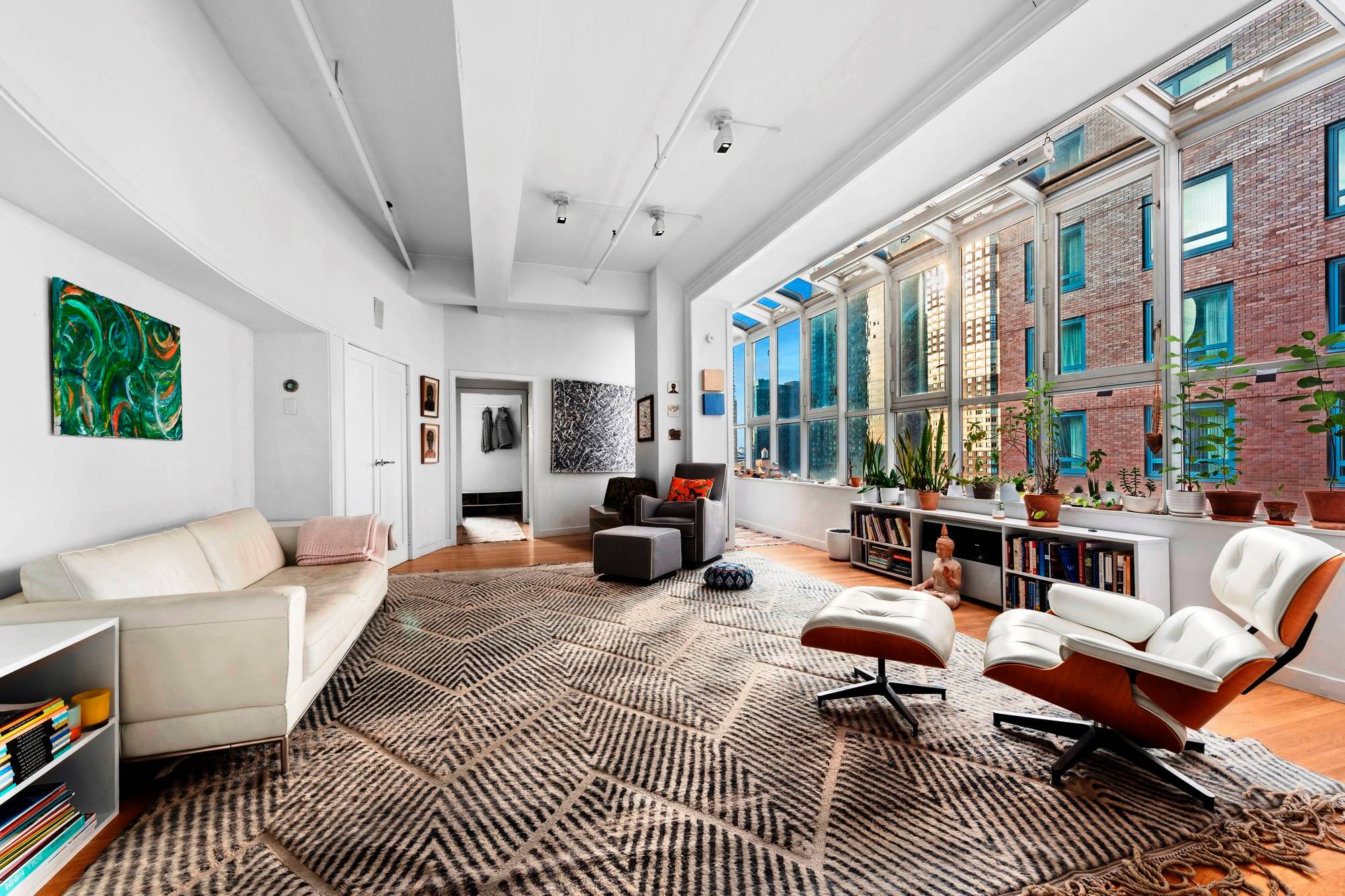 Unique, architecturally designed 1380sf pre war LOFT with 50 feet long contiguous wall of atrium style windows.