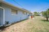 East side of house with door to the 2 car garage