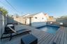 View of pool featuring a deck
