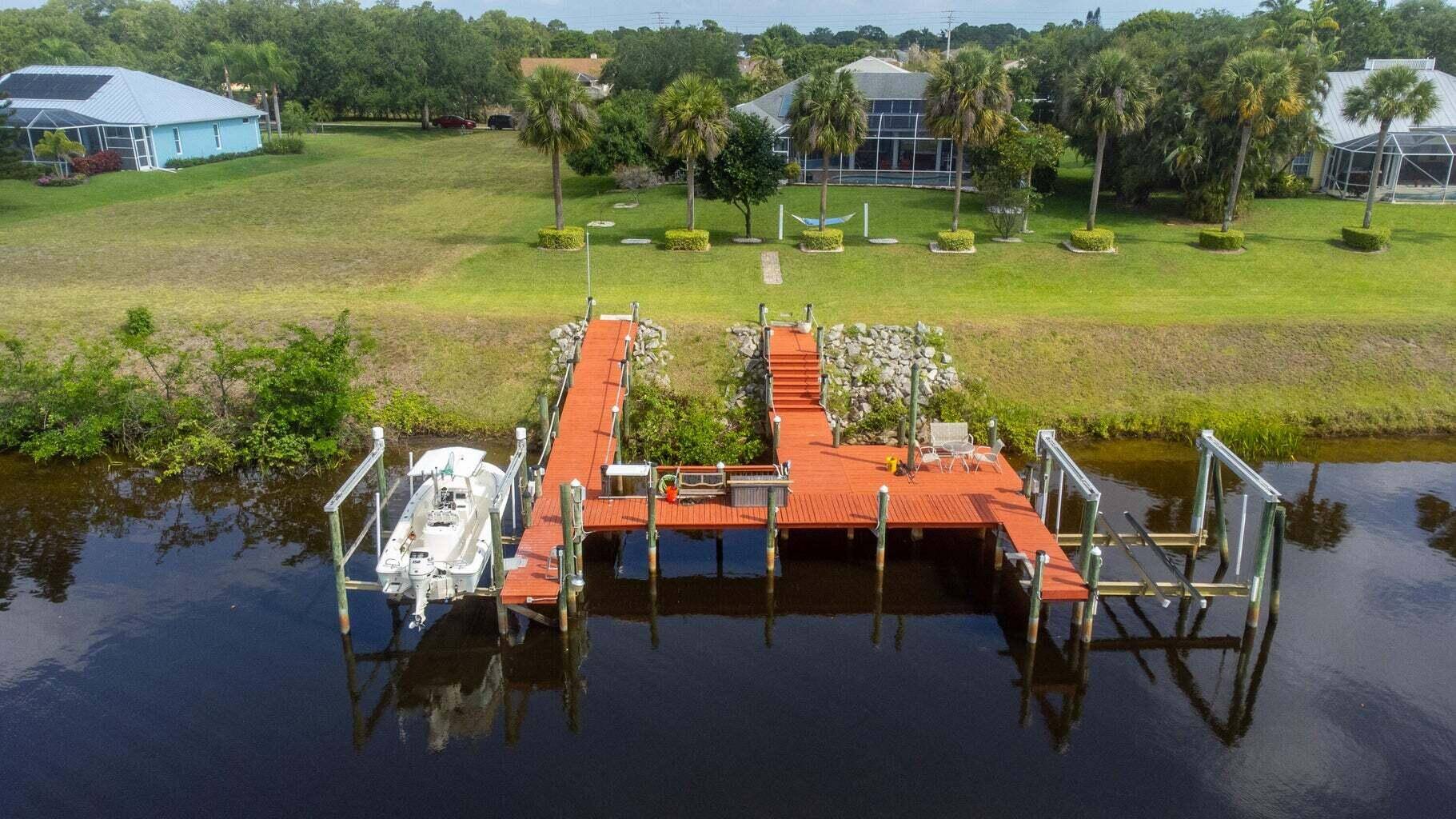 Beautiful 4 bedroom waterfront, pool home with 2 master suites, in Private Gated Community, is a GEM !
