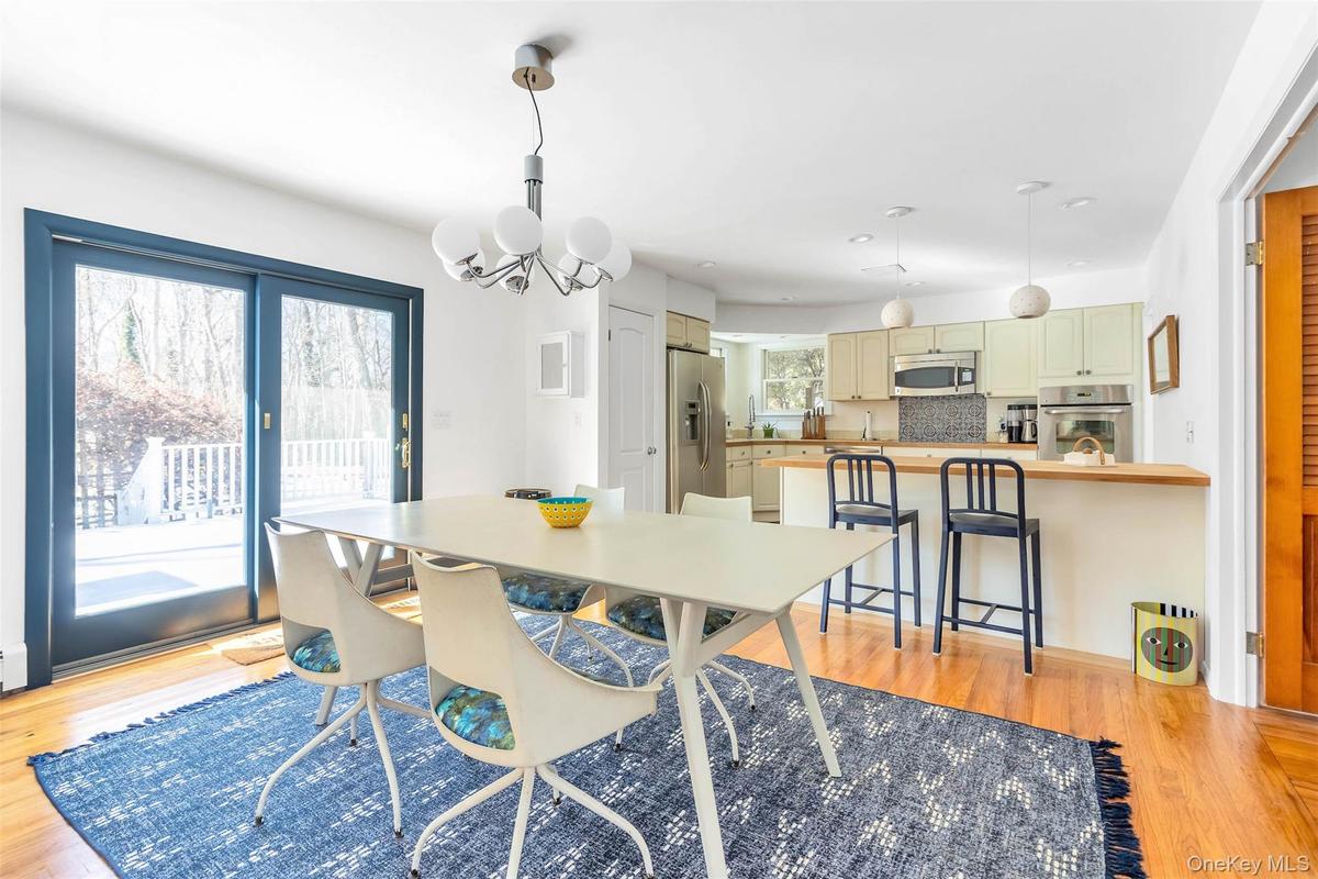 Dining area featuring light hardwood / wood-style flooring and a chandelier