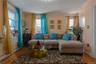 Living room with crown molding, light wood-style floors, and baseboard heating