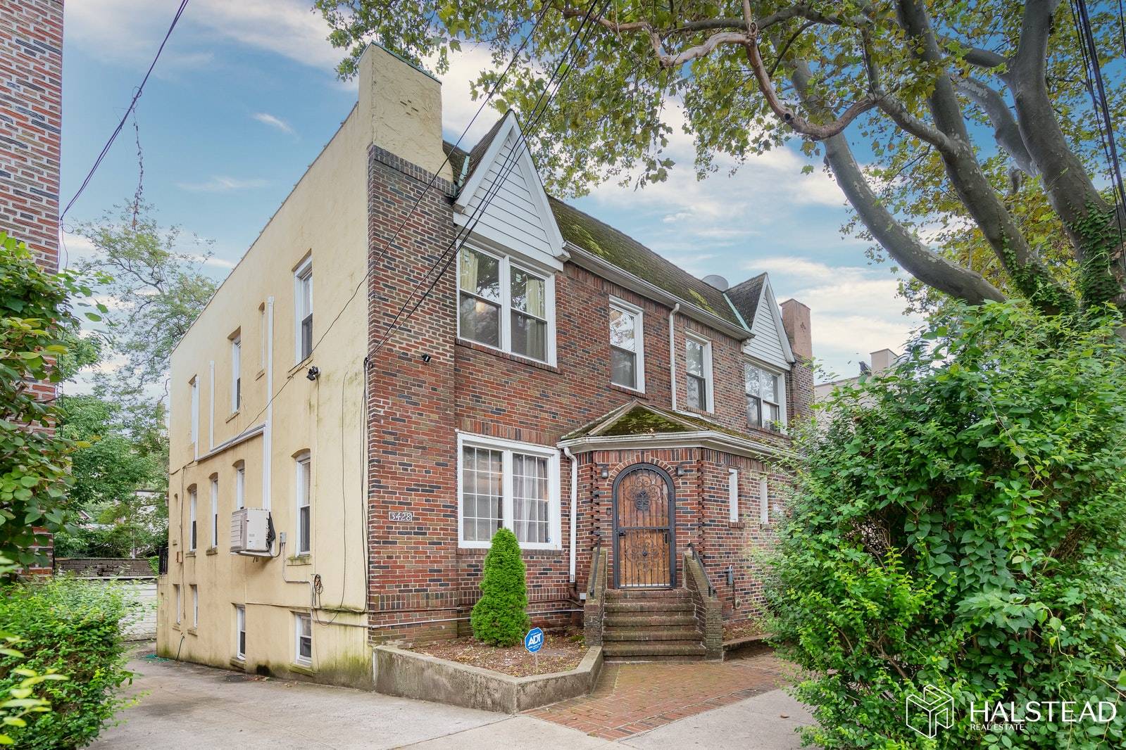 A prewar Brick and Stucco colonial with all its details and charm with Sunken living room, Formal dining room, Inlaid Hardwood flooring amp ; high Ceilings.