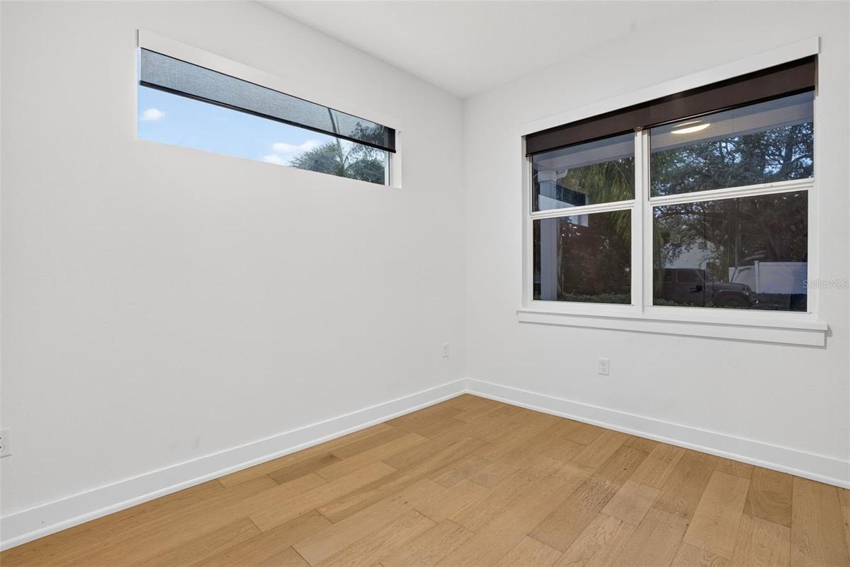 Downstairs bedroom; can also serve as an office, library, or den.