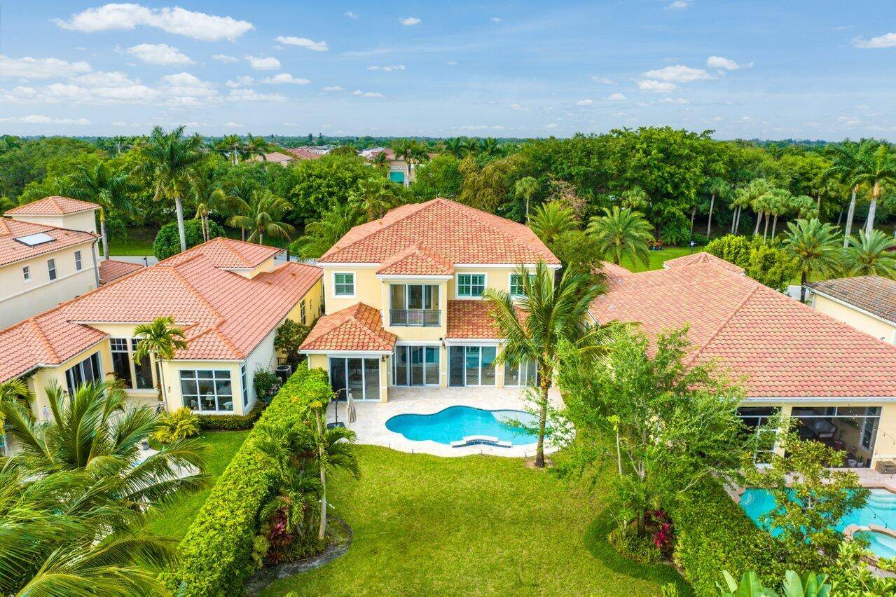 This exceptional six bedroom estate is nestled on an oversized lot overlooking the golf course.