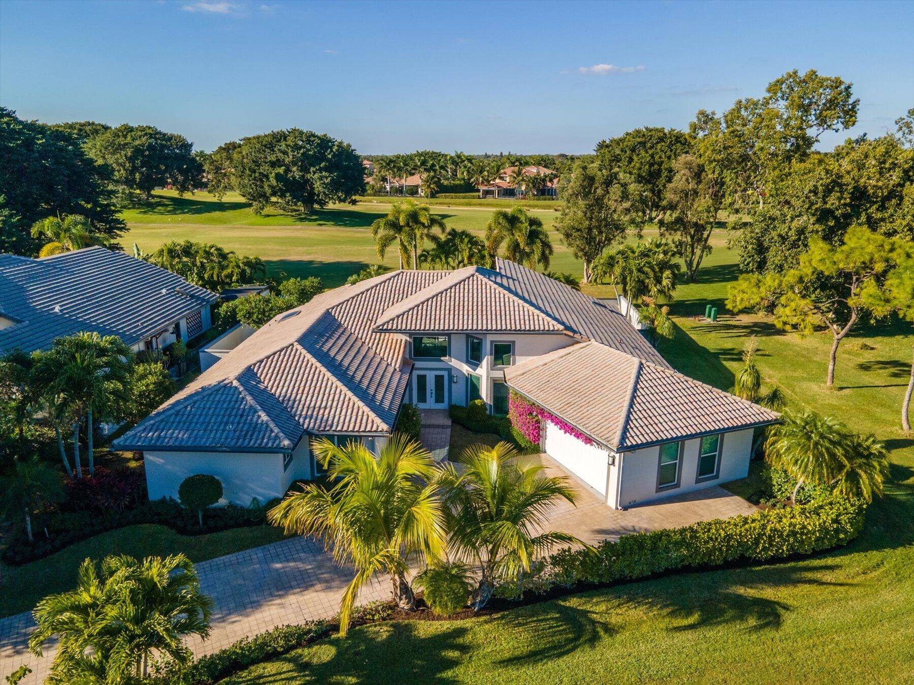 A luxurious contemporary design awaits you in this stunning 4 bedroom, 4 bath home located within the prestigious Palm Beach Polo Golf and Country Club.