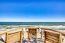 Sip your morning coffee while watching the first light dance across the Atlantic and surfers catching the perfect wave.