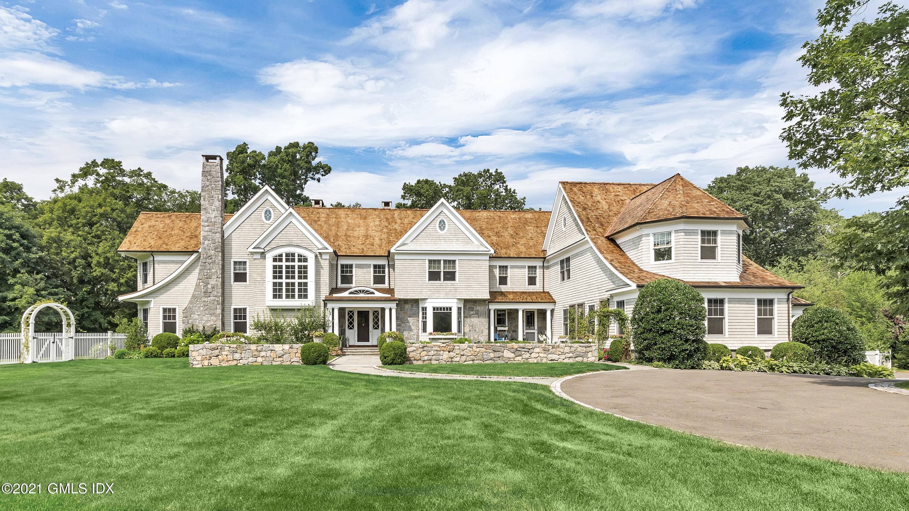 Classic Shingle Style Home beautifully sited on 2.