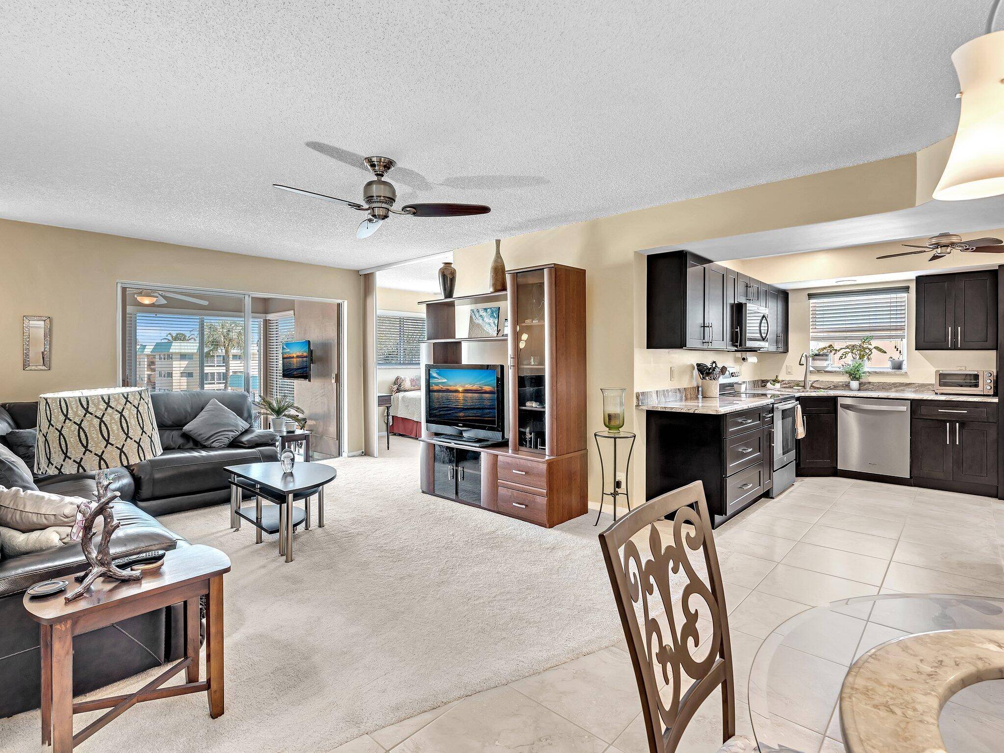 Nestled within Boynton Beach's vibrant 55 community, this exquisite 2 bed, 2 bath corner unit is a testament to meticulous care and timeless elegance.