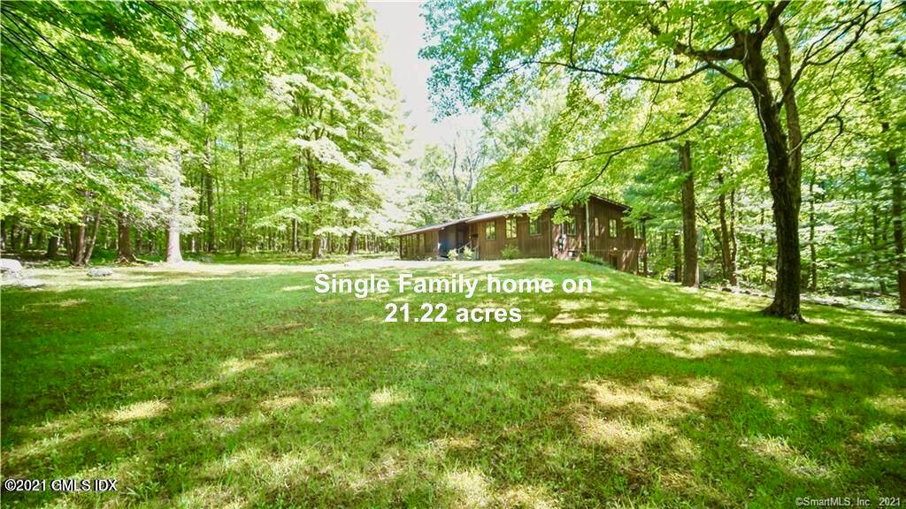 21 unspoiled acres, with a charming Mid Century Modern cabin on site, complete with a small barn, car port and storage shed in the countryside of Newtown.