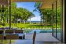 Water views and pool access through retractable glass