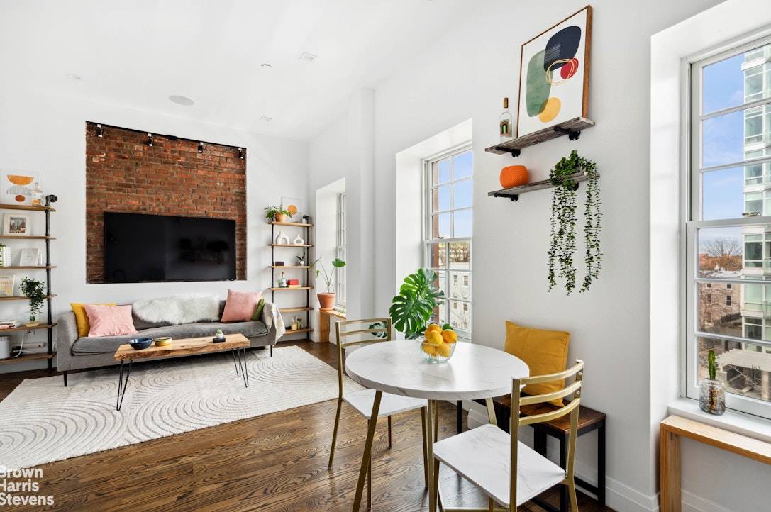 Perched on the top floor of a boutique condominium, this dreamy two bedroom, two bathroom home in vibrant Clinton Hill blends floor through brownstone living with modern elegance.