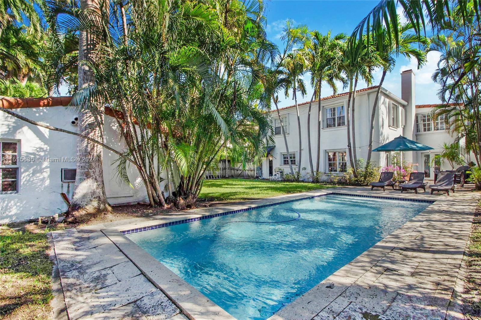Furnished two story Florida Mediterranean bursting with classic charm.