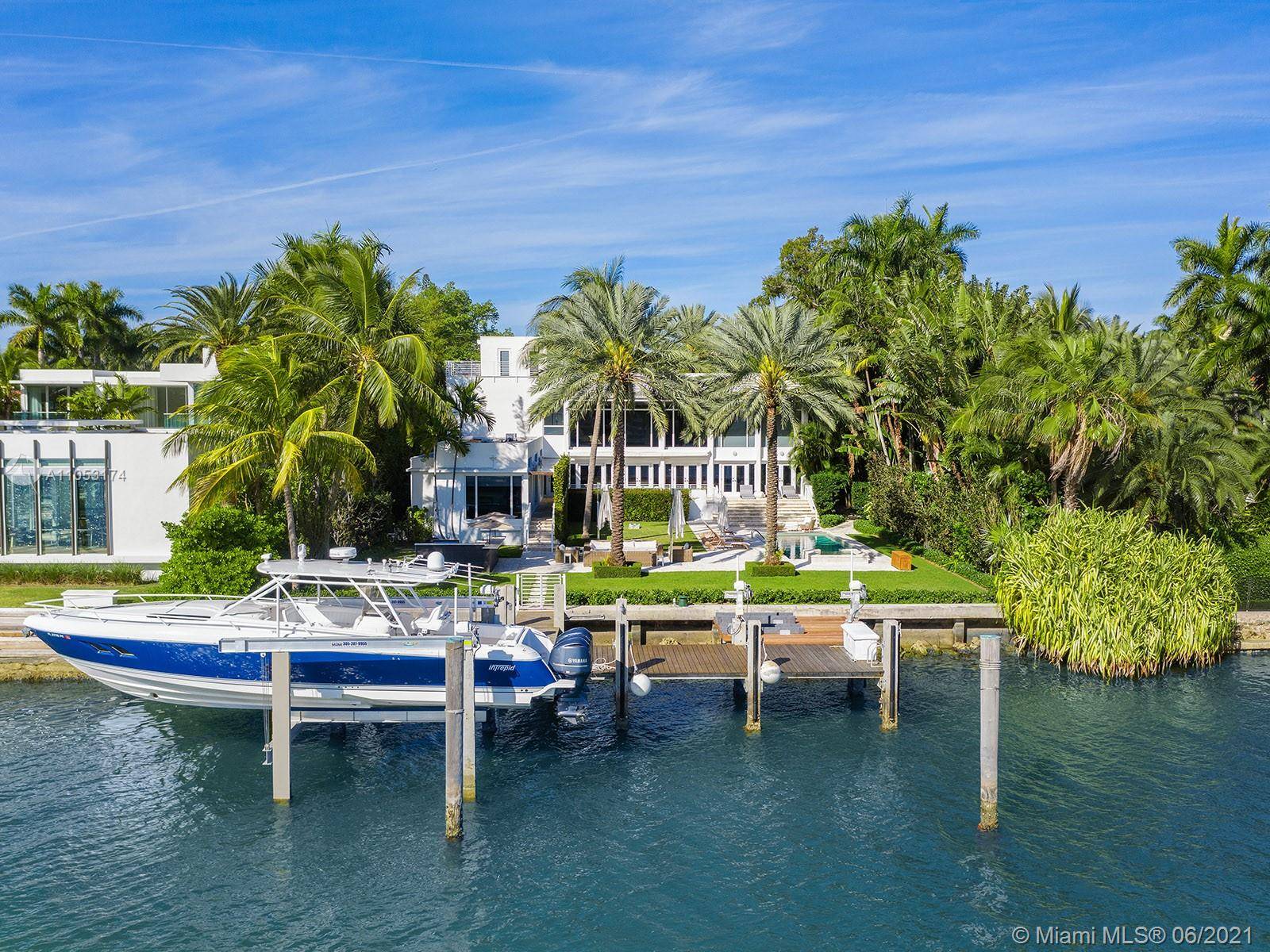 This picturesque contemporary estate is located minutes from South Beach and Downtown Miami, set apart from it all on Miami Beach s tranquil Palm Island.
