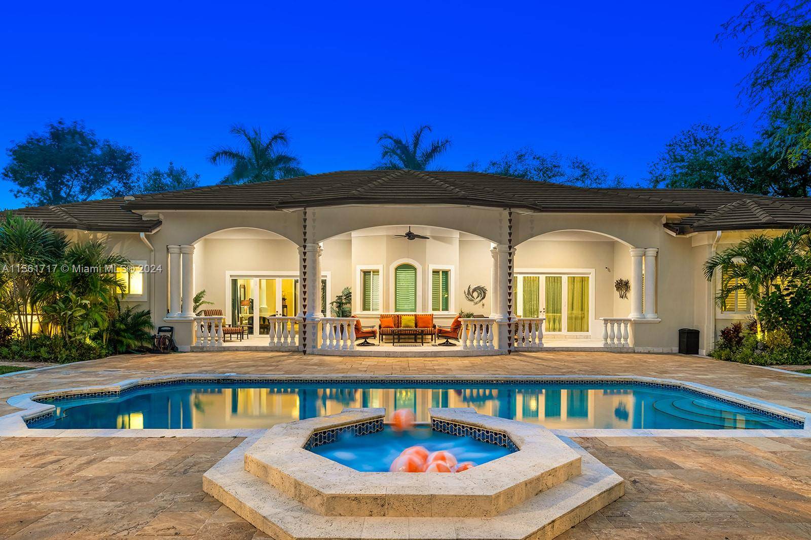 Exceptional estate nestled on a rarely available corner acre lot in the heart of North Pinecrest.