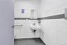 Bathroom with tile walls and a sink
