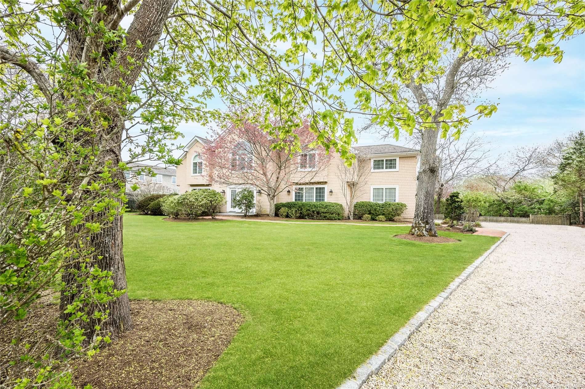 In the heart of Westhampton Village, and tucked in highly coveted Snug Harbor, is your Hampton's dream home.