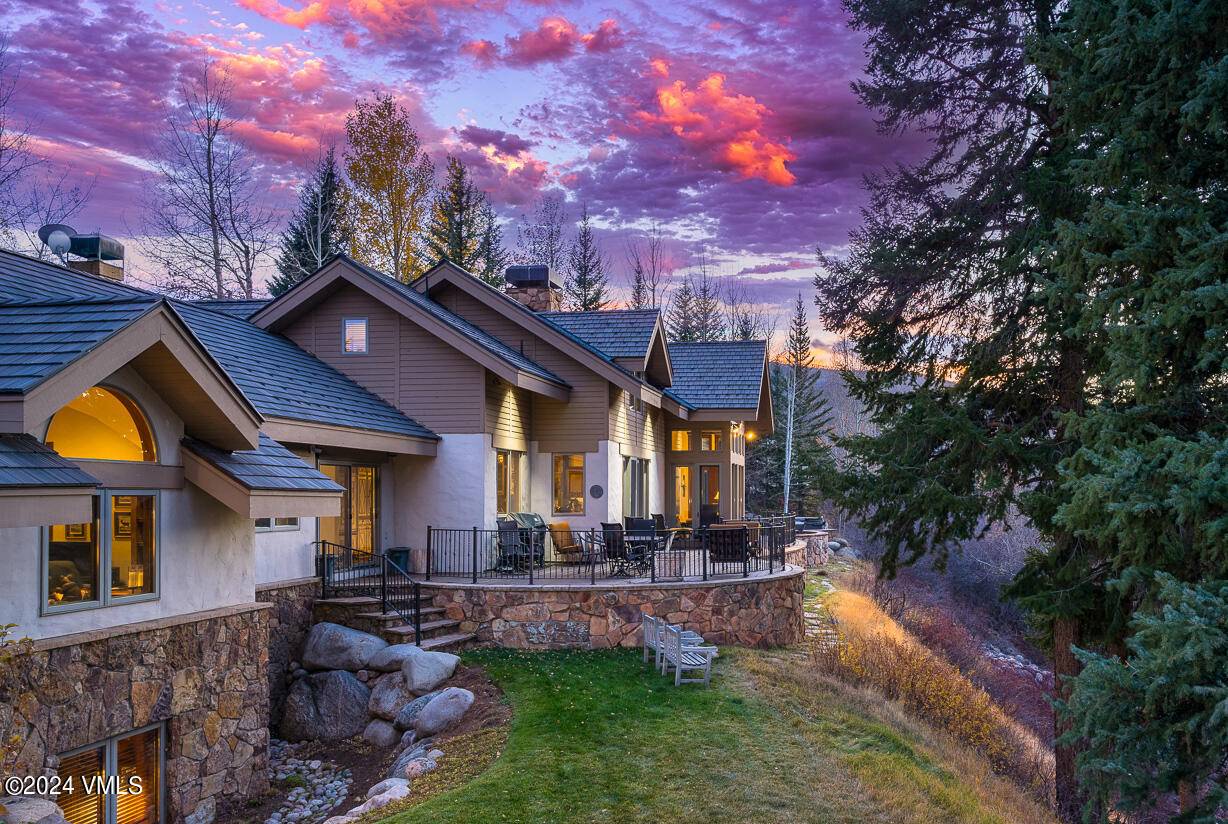 This breathtaking estate in Arrowhead commands one of the most enviable homesites, offering panoramic views of the Eagle River from every vantage point.