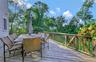 Wooden deck featuring outdoor dining space