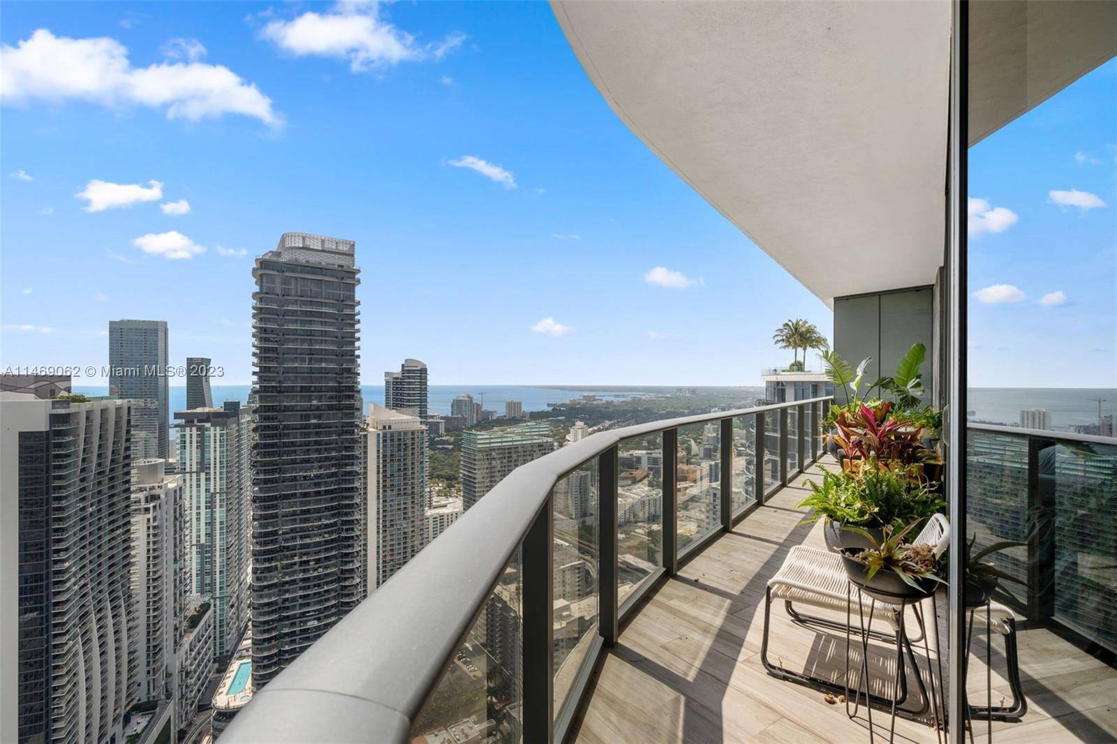 Spectacular 4Bed 4. 5 Bath Corner unit, open floor plan, floor to ceiling walls, 2 master suites, spacious living areas, wrapped around balcony with breathtaking city bay views at SLS ...