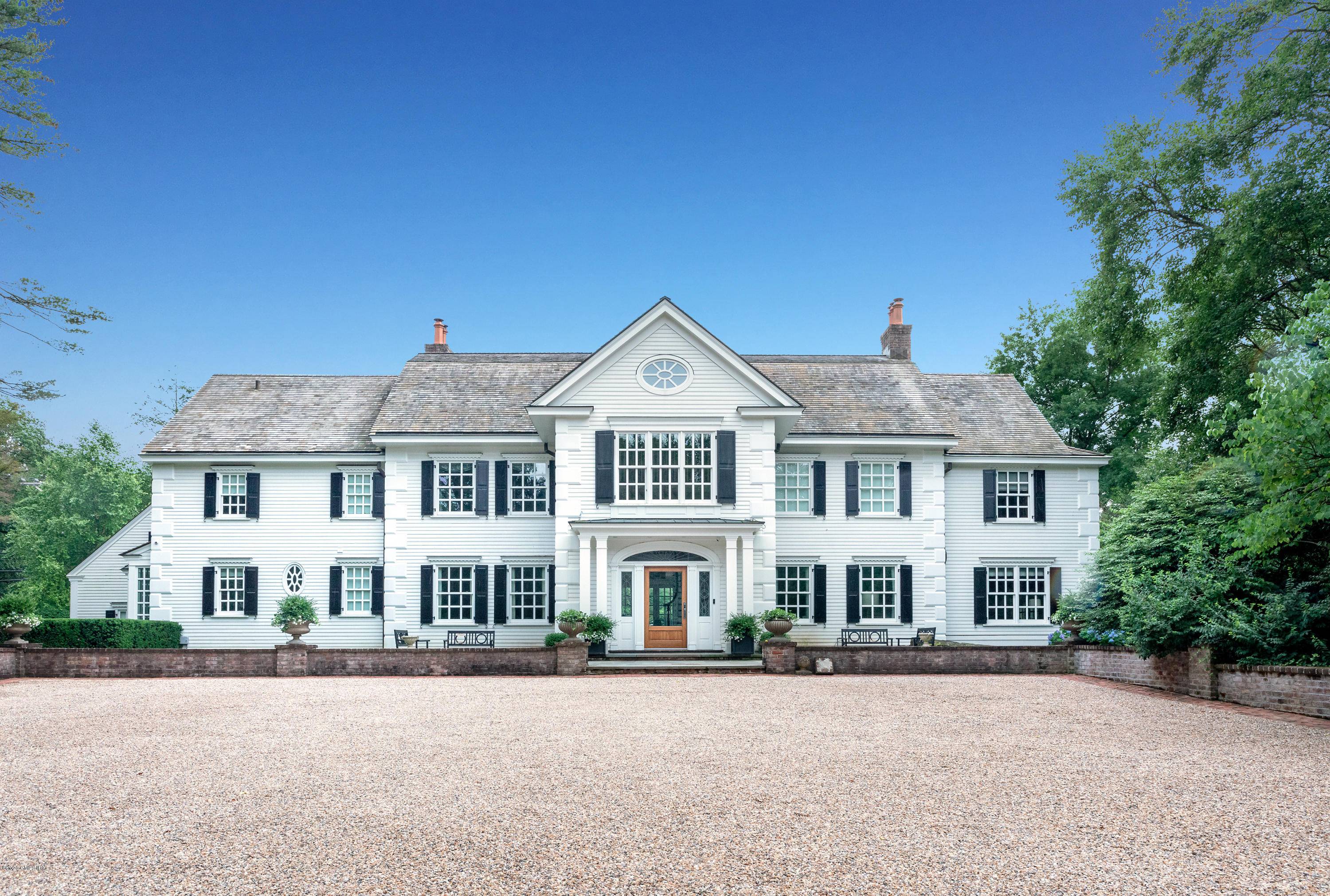The quintessential Georgian Colonial, built in 1913, but completely restored and modernized w the design talent of Barry Bronfman Architect.