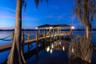 Boat Dock104 Feet Long Wooden Boat Dock23 Ft +/- Boat Lift with a remote dropDual Jet Ski LiftsGazebo with Wooden Table and BenchBuilt In StorageEquip