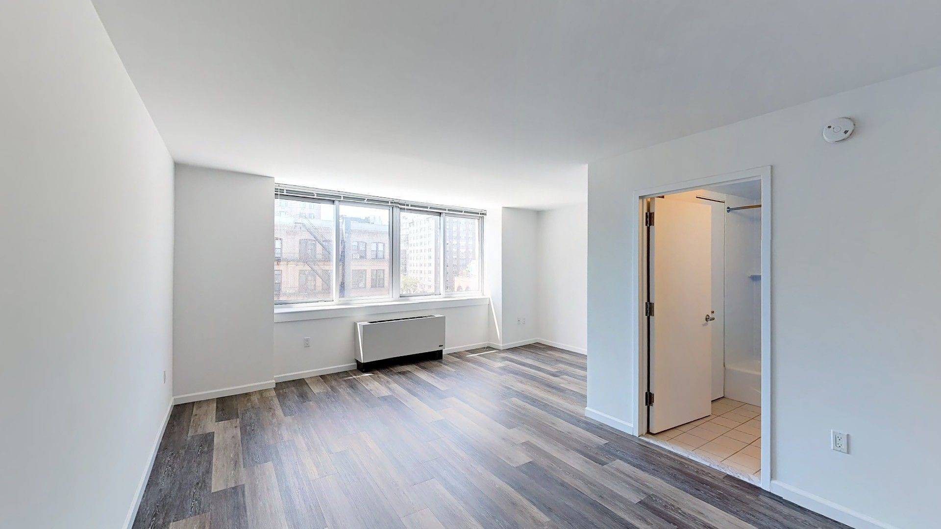 Well designed and newly renovated one bedroom with large private terrace, kitchen with stainless steel appliances, stone countertops and eating bar, floor to ceiling windows, new wood floors throughout, and ...
