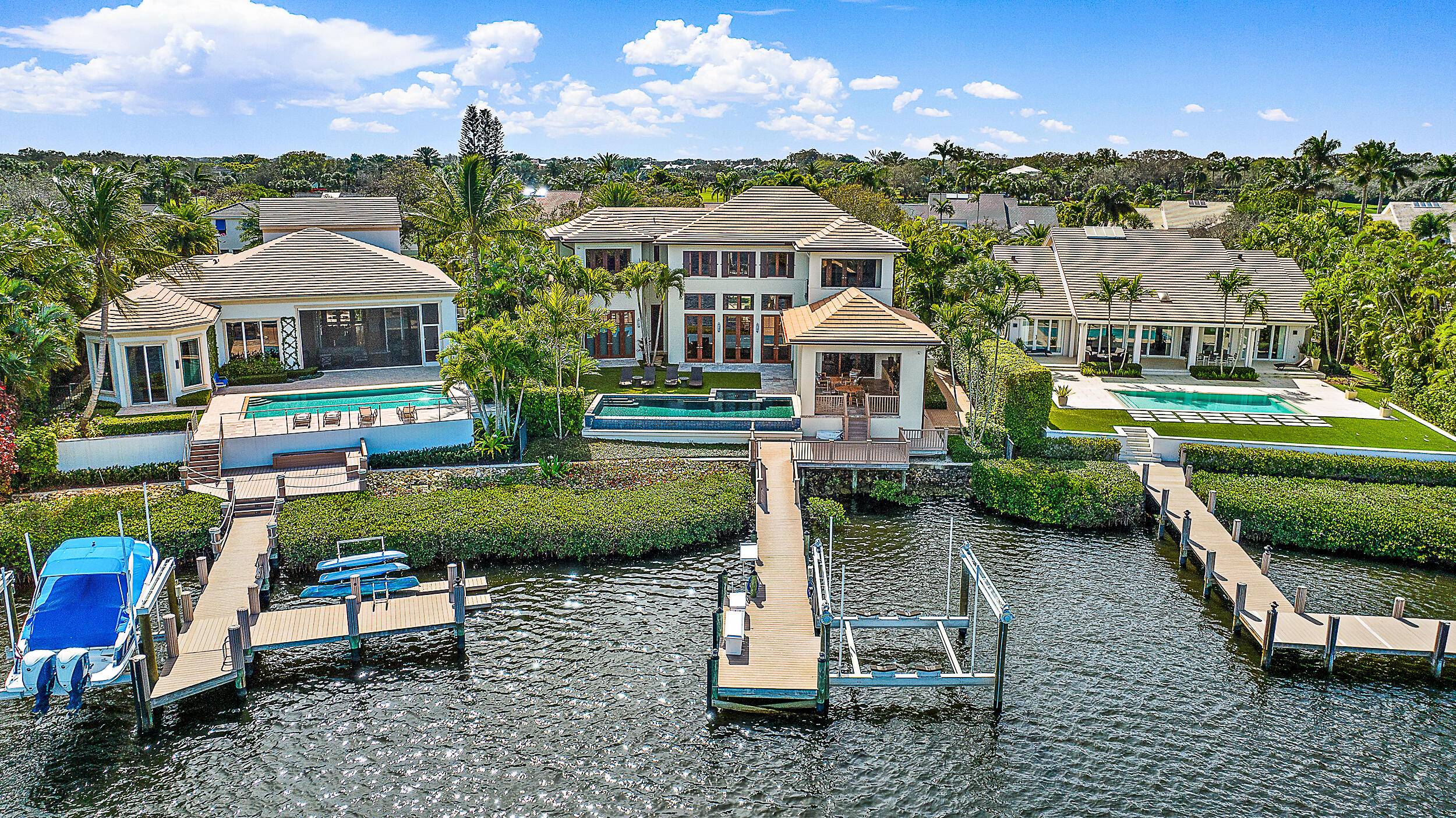 This custom waterfront home built by the award winning Turtle Beach Construction features jaw dropping wide water views from the moment you step through the door.