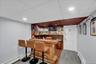 Custom bar area featuring recessed lighting