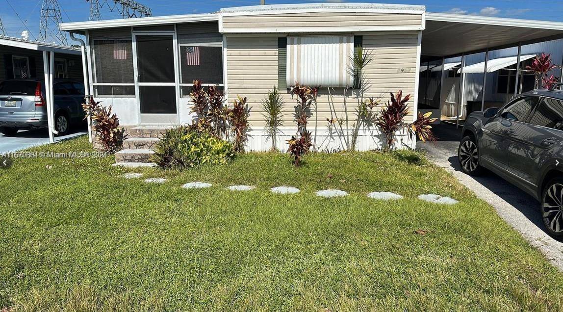 OWN THE LAND, DOUBLE WIDE, ON THE GOLF COURSE, 2 BED 2 BATH MANUFACTURED HOME LOCATED IN THE ESTATES OF FORT LAUDERDALE.