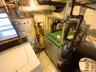 Utilities featuring washer / clothes dryer, gas water heater, and a heating unit
