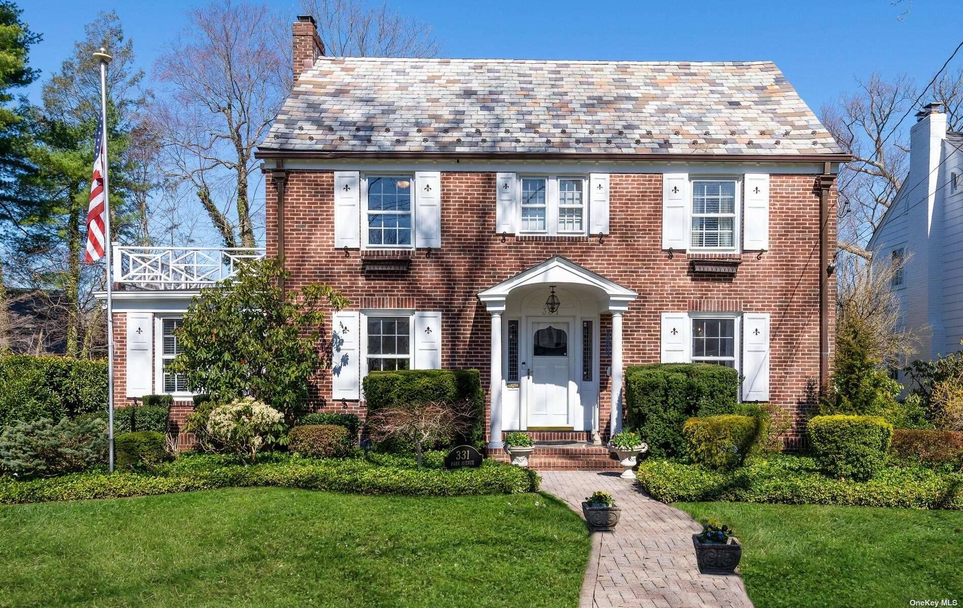 Timeless amp ; elegant 3 story brick CH Colonial set on stunning oversized park like property in the heart of the Village of Munsey Park.