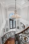 Entryway with a decorative wall, french doors, a chandelier, recessed lighting, and ornamental molding