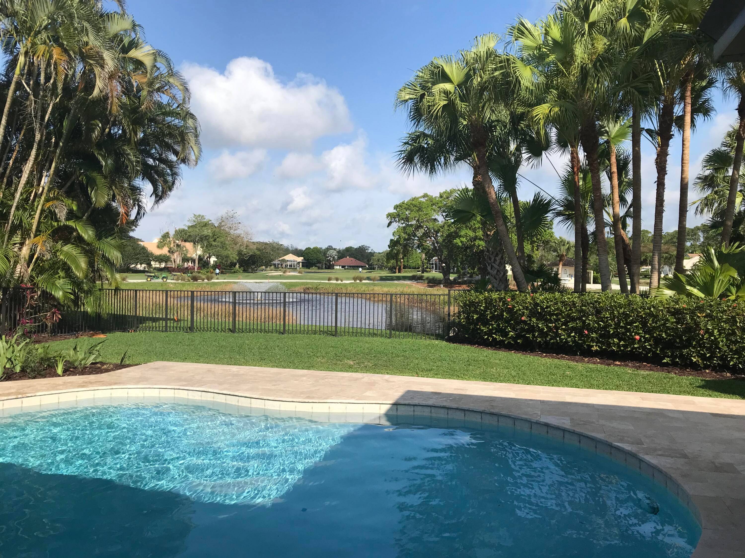 PGA National Trifecta Golf water frontage, private pool and fresh, welcoming remodel !