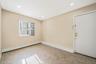 Spare room with a baseboard heating unit, recessed lighting, and light tile patterned flooring