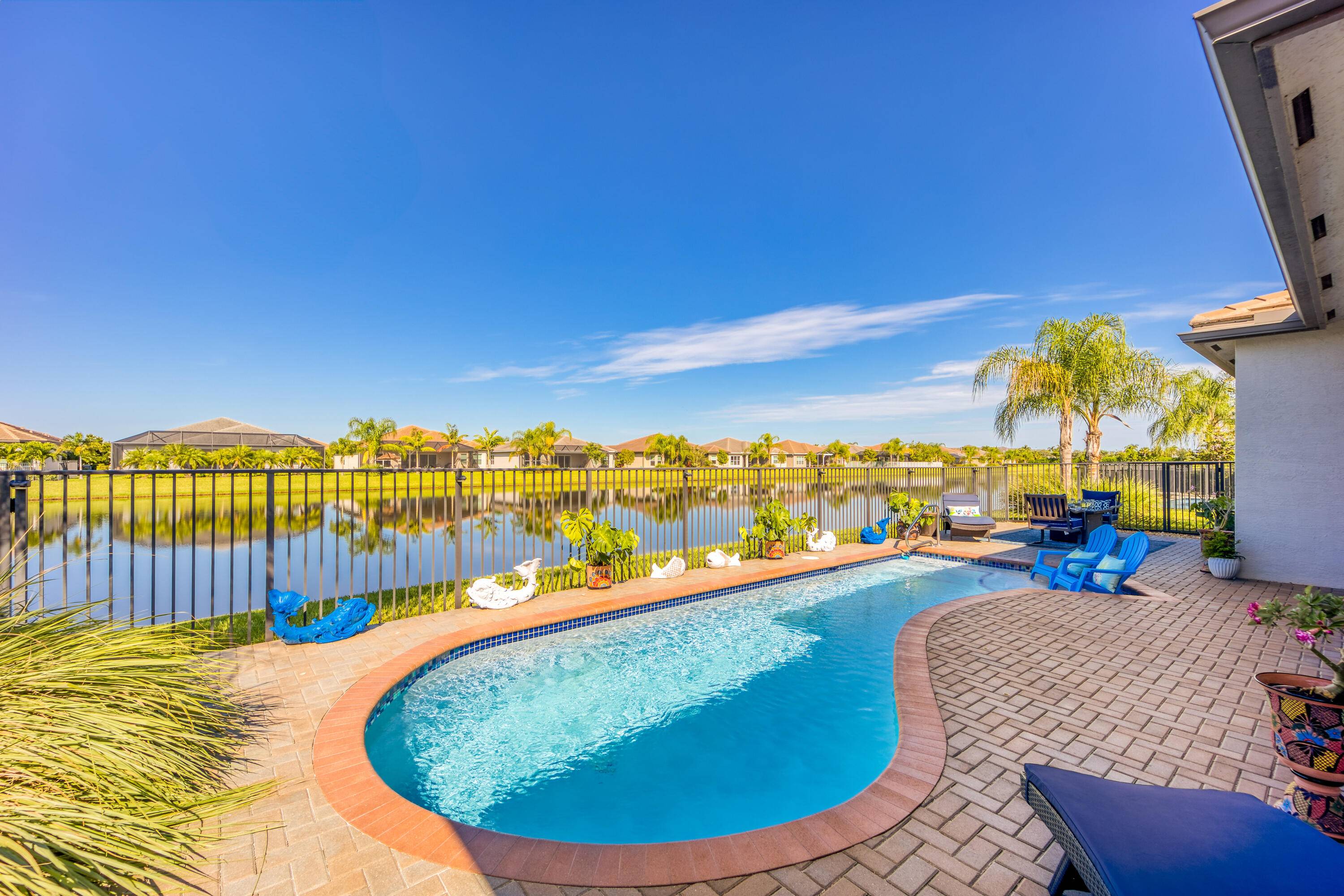 PRICE REDUCTION ! This elegant and dramatic Caroline Model in Riverland's, Valencia Cay 55 community emulates the chic Florida Coastal Design that so many people are looking for.