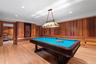 Rec room featuring billiards, wooden walls, crown molding, light wood-type flooring, and recessed lighting