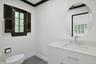 Thoughtfully renovated, the chic powder room combines timeless finishes with contemporary style for guests and everyday convenience.